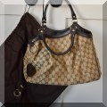 H02. Gucci logo handbag. 